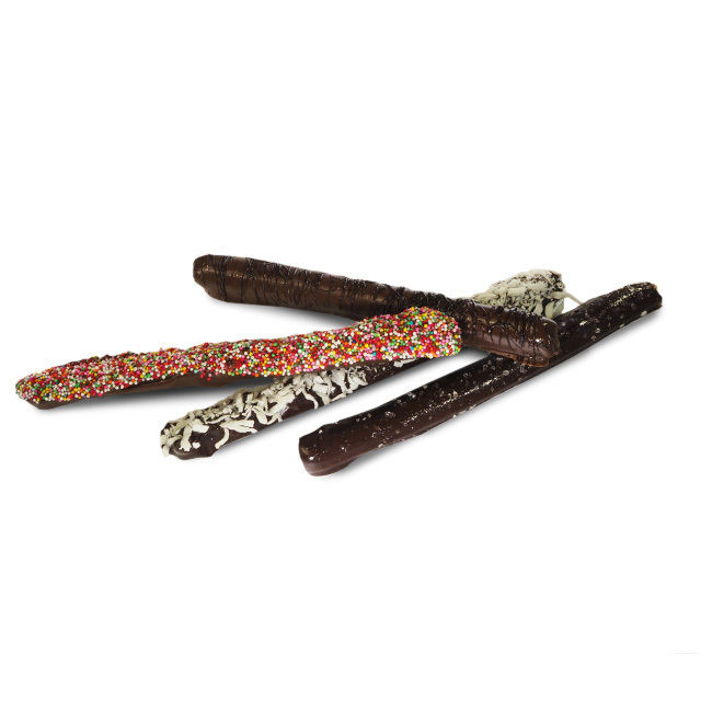 Pretzel rods covered in chocolate with seasonal candy decorations on top Party Pretzels
